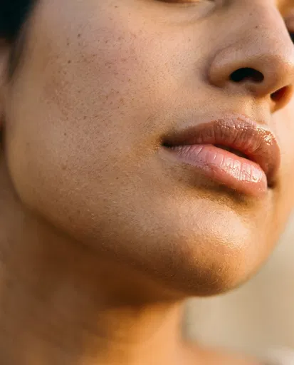 Macro Portrait of Glossy Lips and Skin