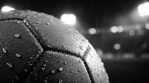 Wet Soccer Ball Under Stadium Lights