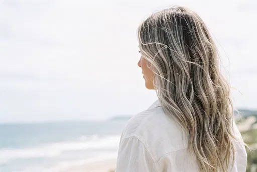 Woman With Ash Blonde Hair At Beach