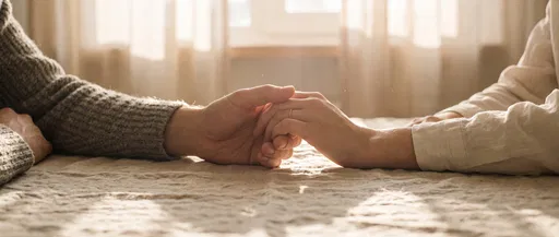 Couple Holding Hands on Linen Table