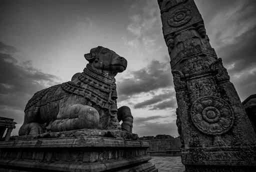 Monochrome Stone Nandi Bull and Temple Pillar