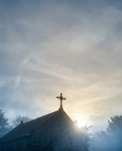 Wrought-Iron Cross on Misty Chapel Roof