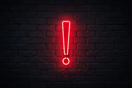 Red Neon Exclamation Mark on Brick Wall