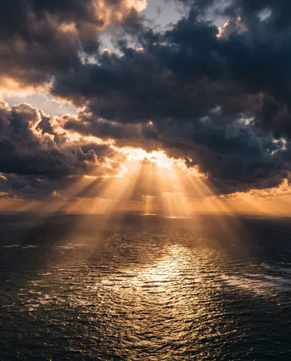 Golden Sunbeams Over Dark Ocean