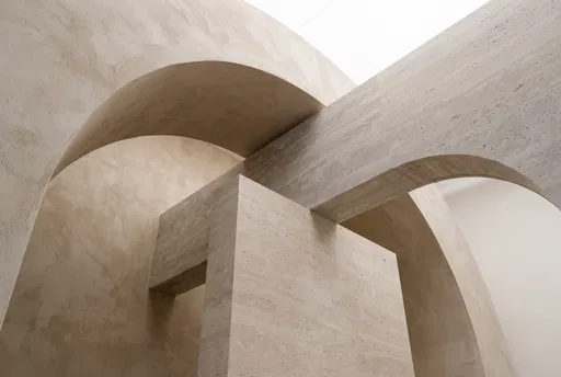 Minimalist Plaster Arches and Travertine Stone