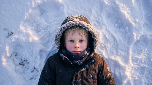 Overhead Portrait of Boy in Snow