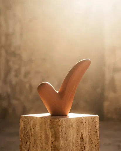 Terracotta Checkmark Sculpture on Stone Pedestal
