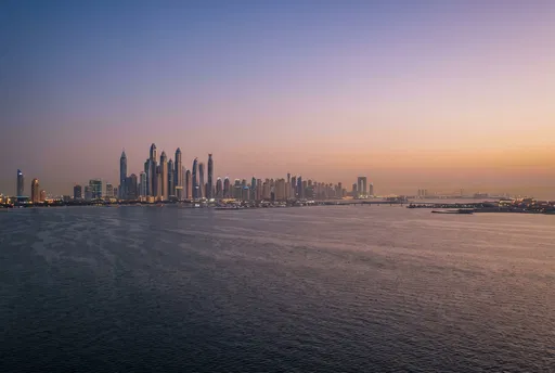 Distant Coastal City Skyline at Twilight