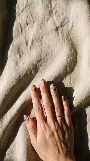 Hand With Neutral Autumn Dot Art Nails