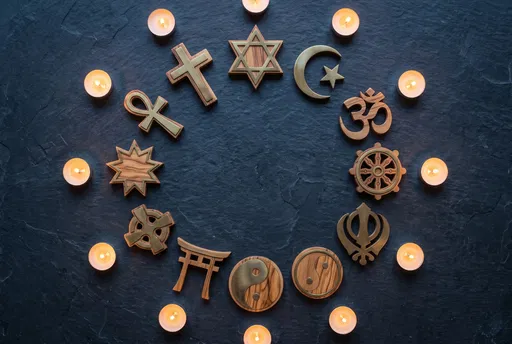 Circle of Wooden Religious Symbols and Candles