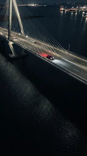 Red Supercar Crossing Bridge at Night