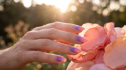 Hand With Ombre Nails Touching Silk Petals