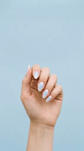 Hand With Pastel Blue Aura Nail Art