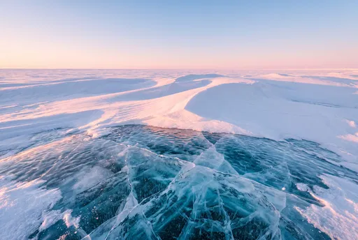 Pink Alpenglow Over Cracked Blue Ice
