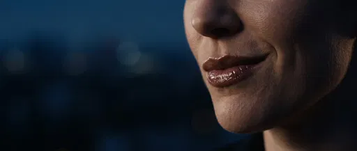 Close-Up of Woman Smirking at Blue Hour