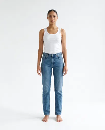 Woman in White Tank and Jeans