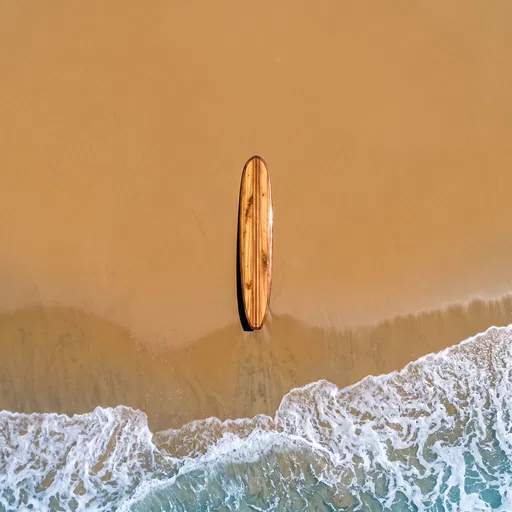Overhead View of Wooden Surfboard on Beach