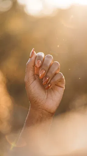 Hand With Terracotta Gold Leaf Manicure