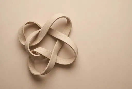 Minimalist Beige Ceramic Ribbon Sculpture