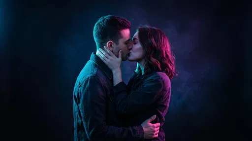Couple Kissing Under Neon Studio Lighting