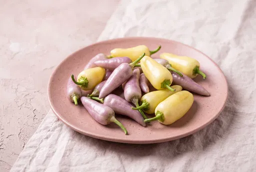 Lavender and Yellow Peppers on Pink Plate