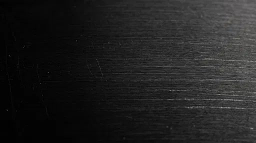 Brushed Black Titanium Metal Macro Texture