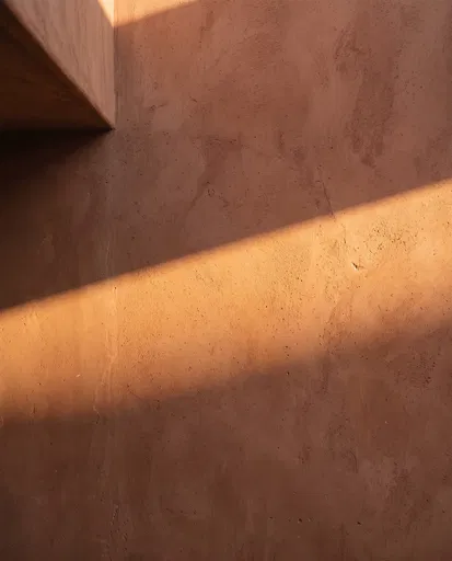 Sunlight on Terracotta Plaster Wall