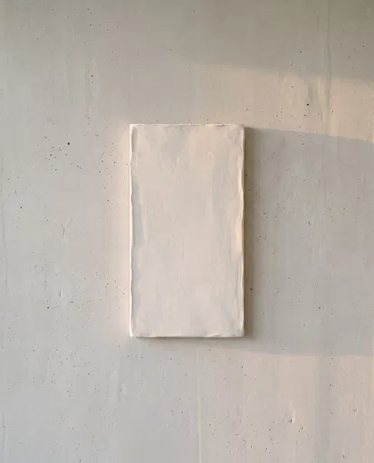 White Plaster Slab on Concrete Wall