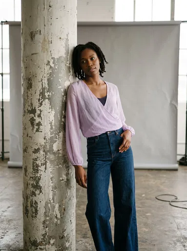 Woman Leaning on Studio Pillar