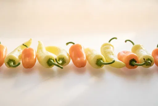 Row of Yellow and Orange Peppers