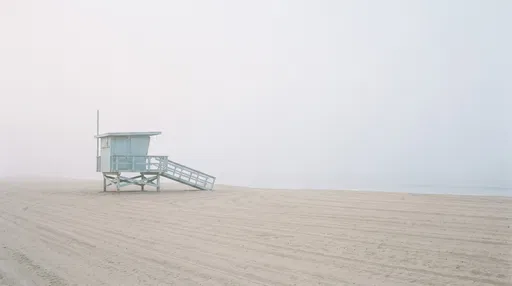 Minimalist Blue Lifeguard Tower in Beach Fog