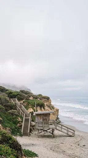Wooden Lifeguard Tower on Overcast Coast