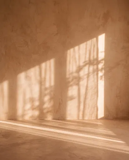 Warm Terracotta Plaster Wall With Sunlight Shadows