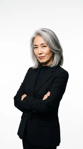 Confident Silver-Haired Woman in Black Blazer