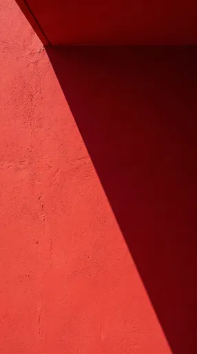Red Stucco Wall With Diagonal Shadow