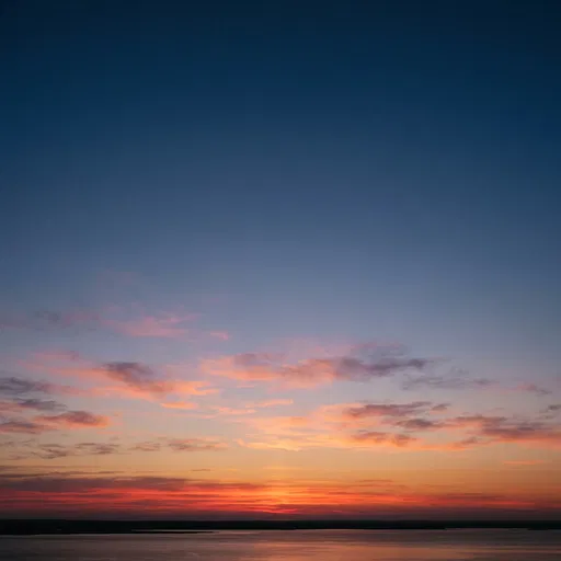 Crimson Dawn Sky Over Calm Water