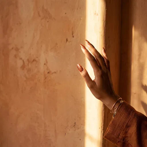Hand With Terracotta Nail Art in Sunlight