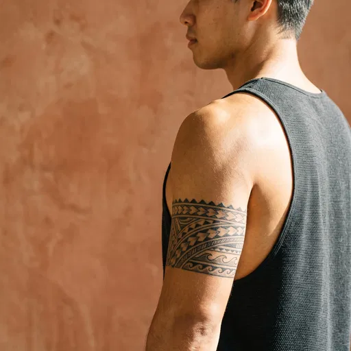 Man With Geometric Armband Tattoo in Sunlight