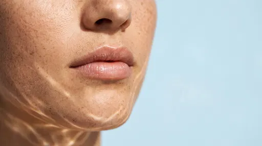Macro Close-Up of Freckled Skin and Lips