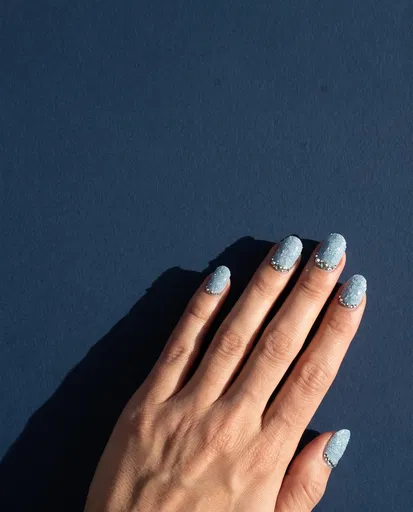 Hand With Icy Blue Glitter Nail Art
