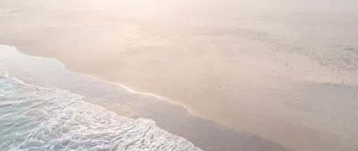 Aerial View of Hazy Morning Beach