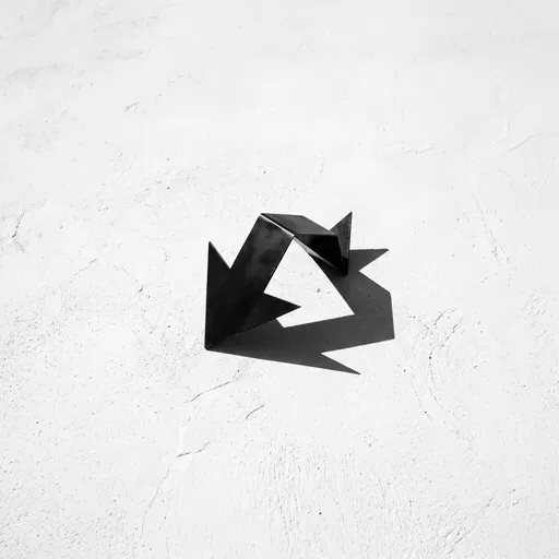 Folded Black Metal Arrow on Plaster