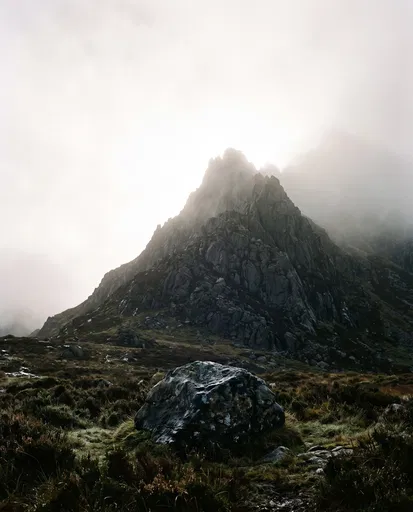 Misty Jagged Mountain Peak and Boulder