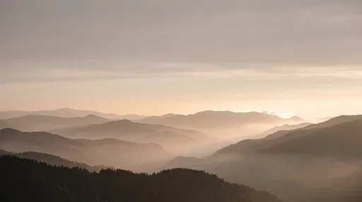 Misty Mountain Ridges at Hazy Sunset