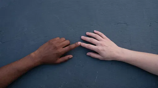 Two Diverse Hands Touching Index Fingers