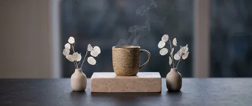 Steaming Stoneware Mug on Travertine Plinth