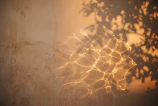 Sunlight Caustics and Shadows on Plaster Wall
