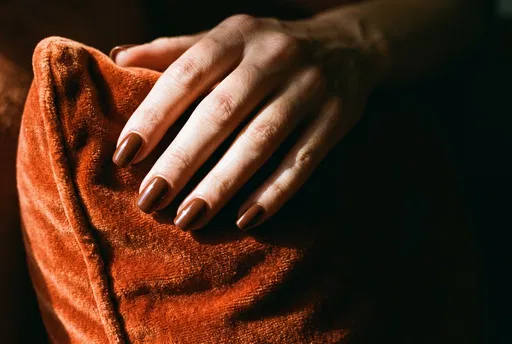 Hand With Glossy Chocolate Brown Nails