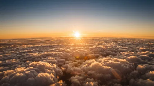 Golden Sunset Above Endless Fluffy Clouds