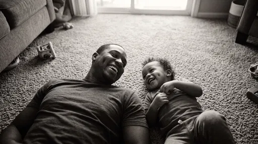 Father and Toddler Laughing on Carpet